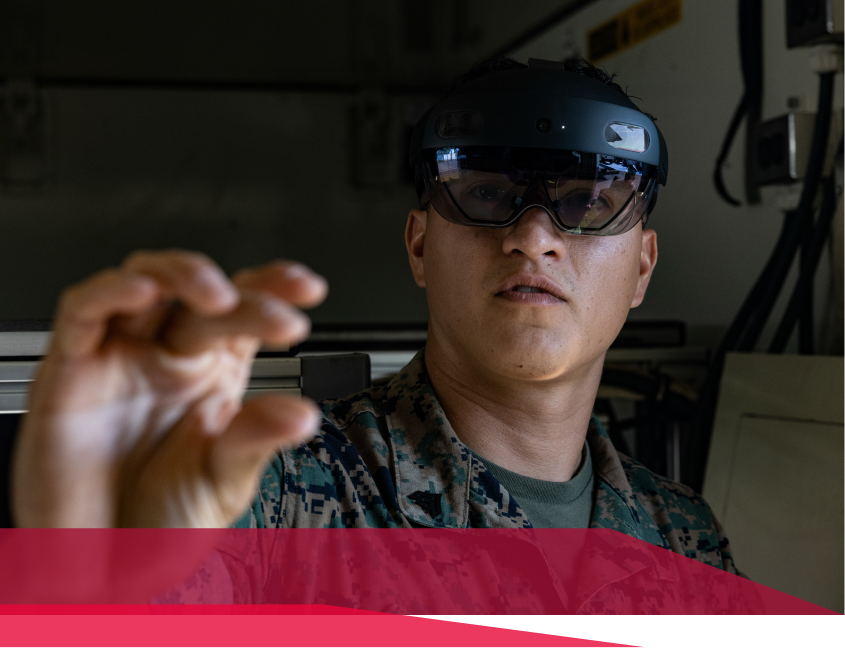 A man in a military uniform is wearing a virtual reality headset.