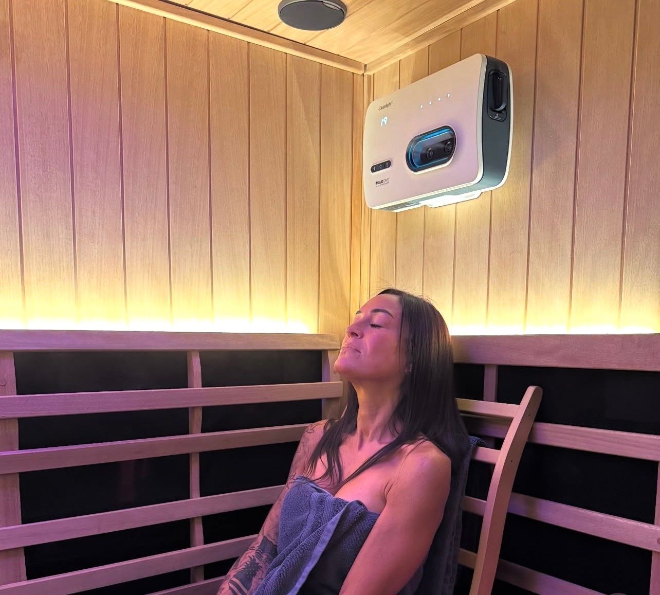 Woman in white underwear, back view, hand on hip, against a white background.