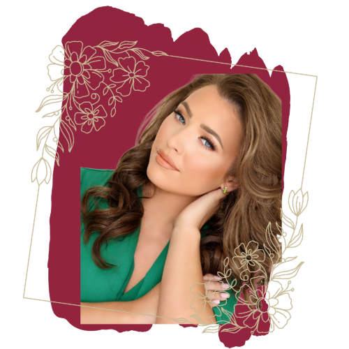 Woman with long, wavy brown hair, in a green dress. Hand near face, against a maroon floral background.