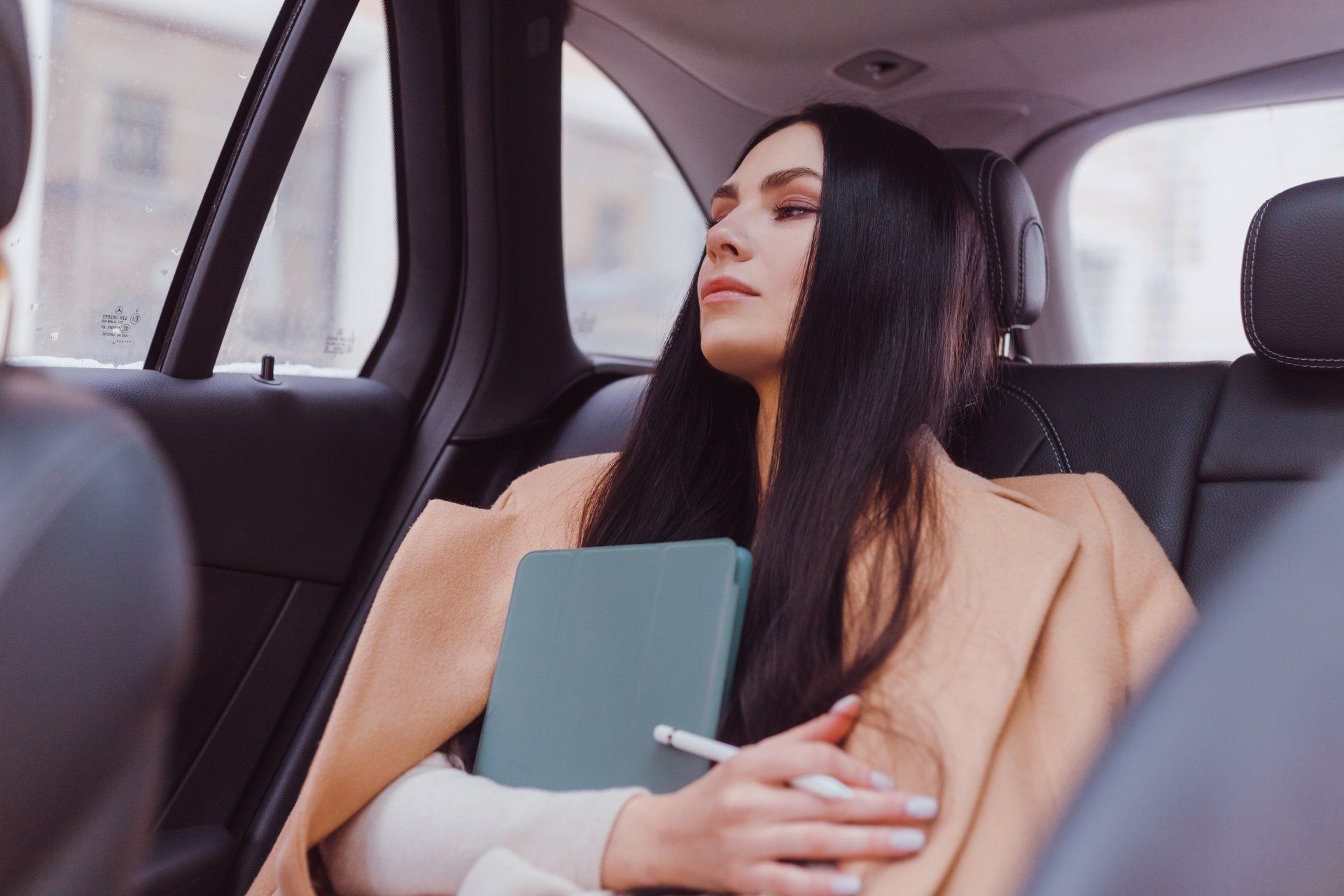 a business woman travelling in a car