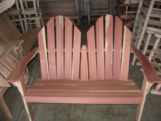 A wooden chair is sitting in a room with other chairs