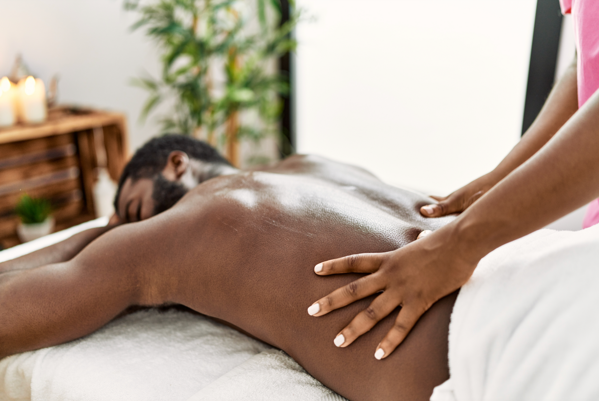 A man is getting a massage at a spa.
