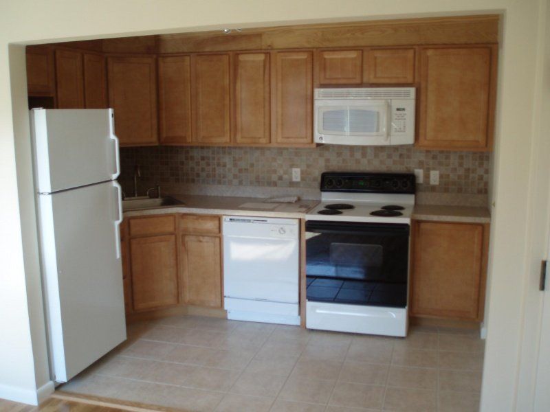 Kitchen with Wooden Cabinets — Cape Cod, MA — BelPort Building & Remodeling, LLC