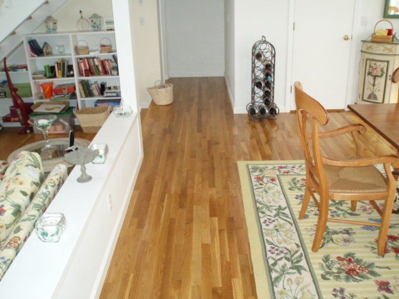 Wooden Floor with Rug — Cape Cod, MA — BelPort Building & Remodeling, LLC