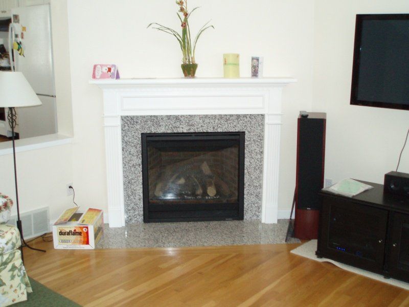 Wooden Floor and Fireplace — Cape Cod, MA — BelPort Building & Remodeling, LLC