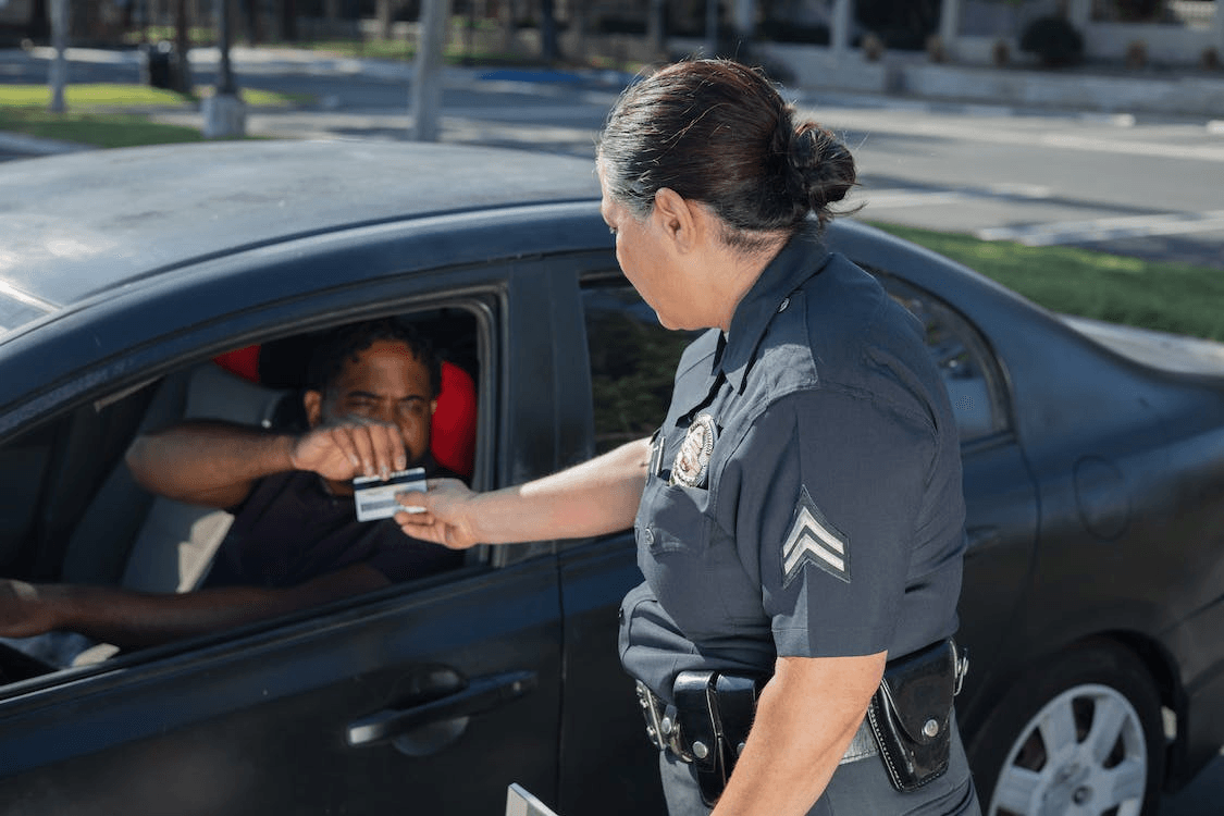an officer checking a driver’s license