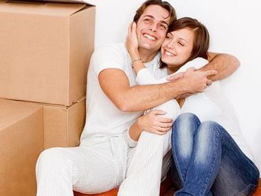 Broadway Transfer & Storage Russellville AR Services residential moving couple smiling moving box