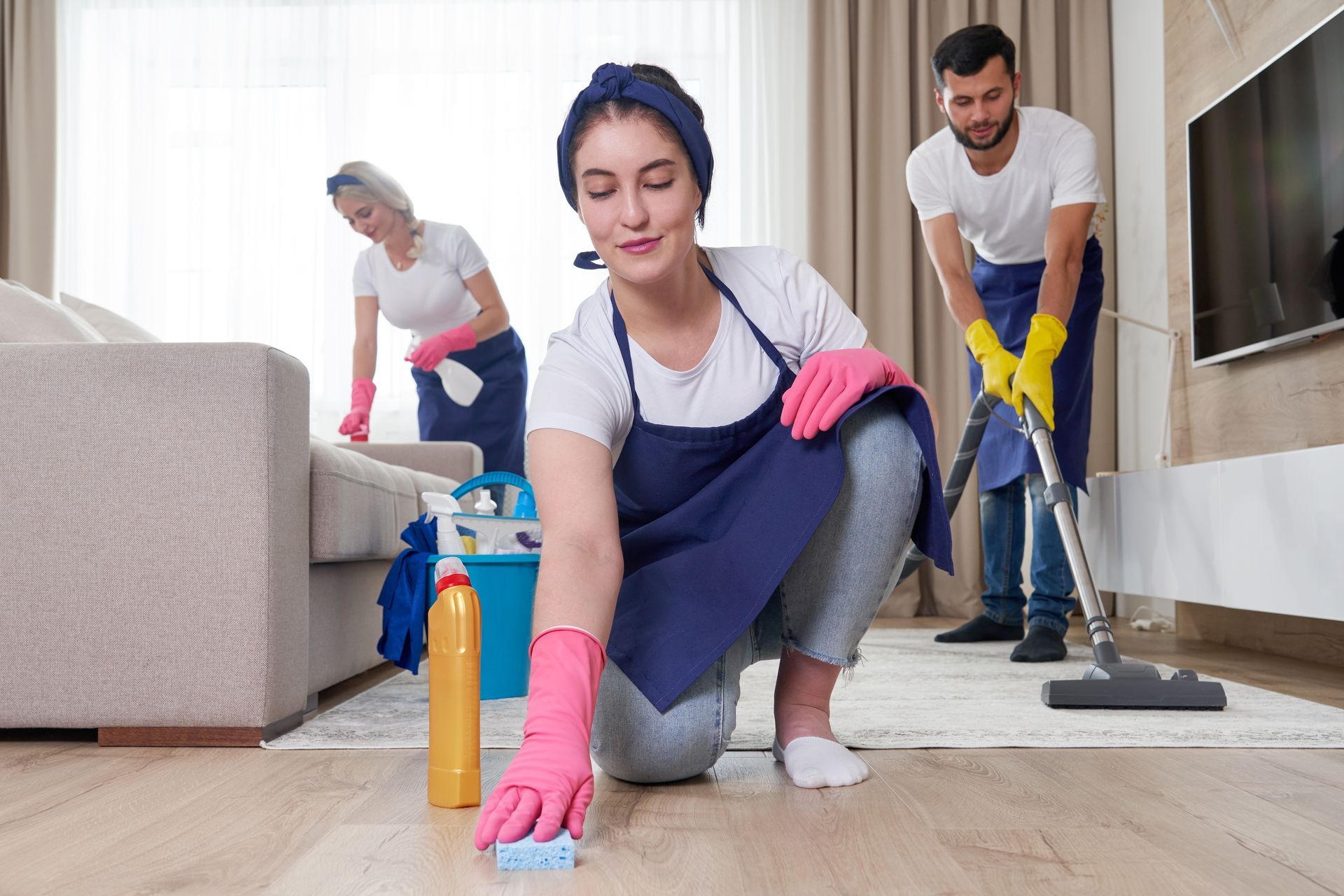professional cleaning service team cleans a modern living room