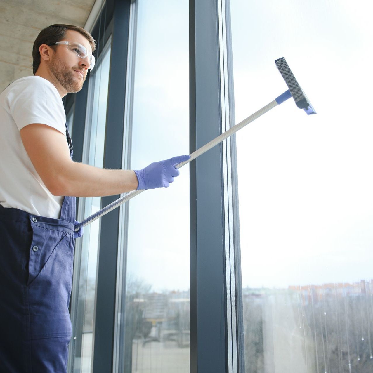 man cleaning windows