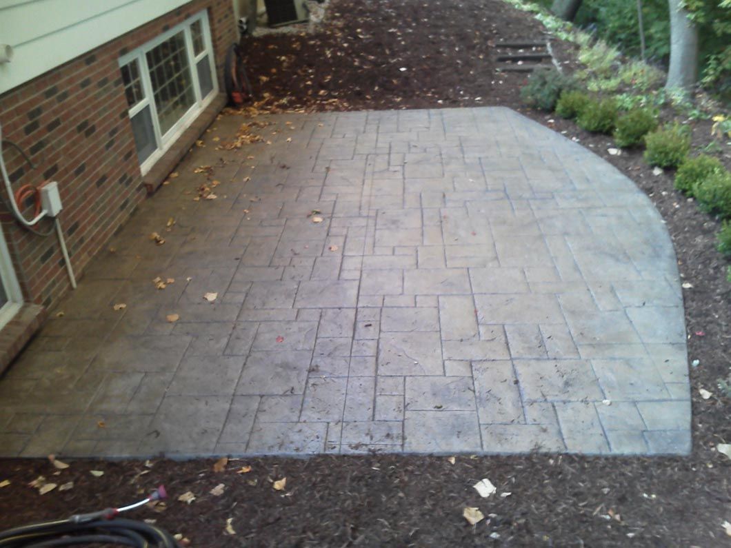 A brick house with a patio in front of it