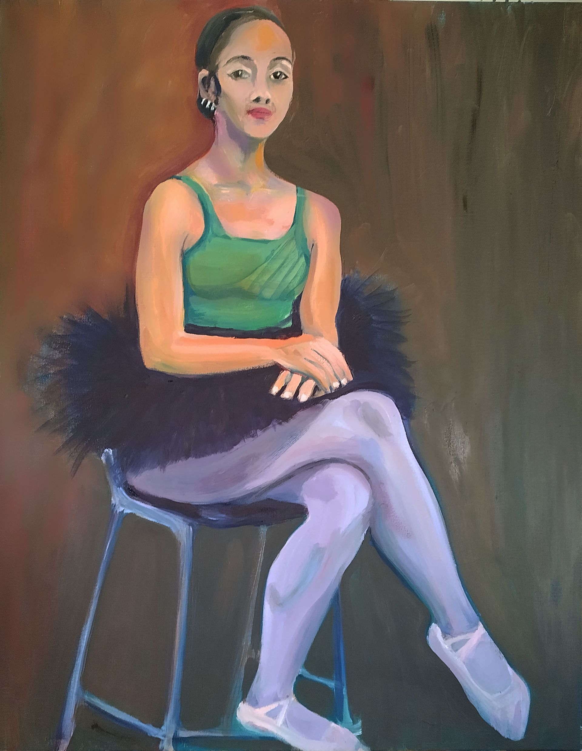 Ballet dancer in green top and black tutu sits on a stool, wearing purple tights and white shoes.