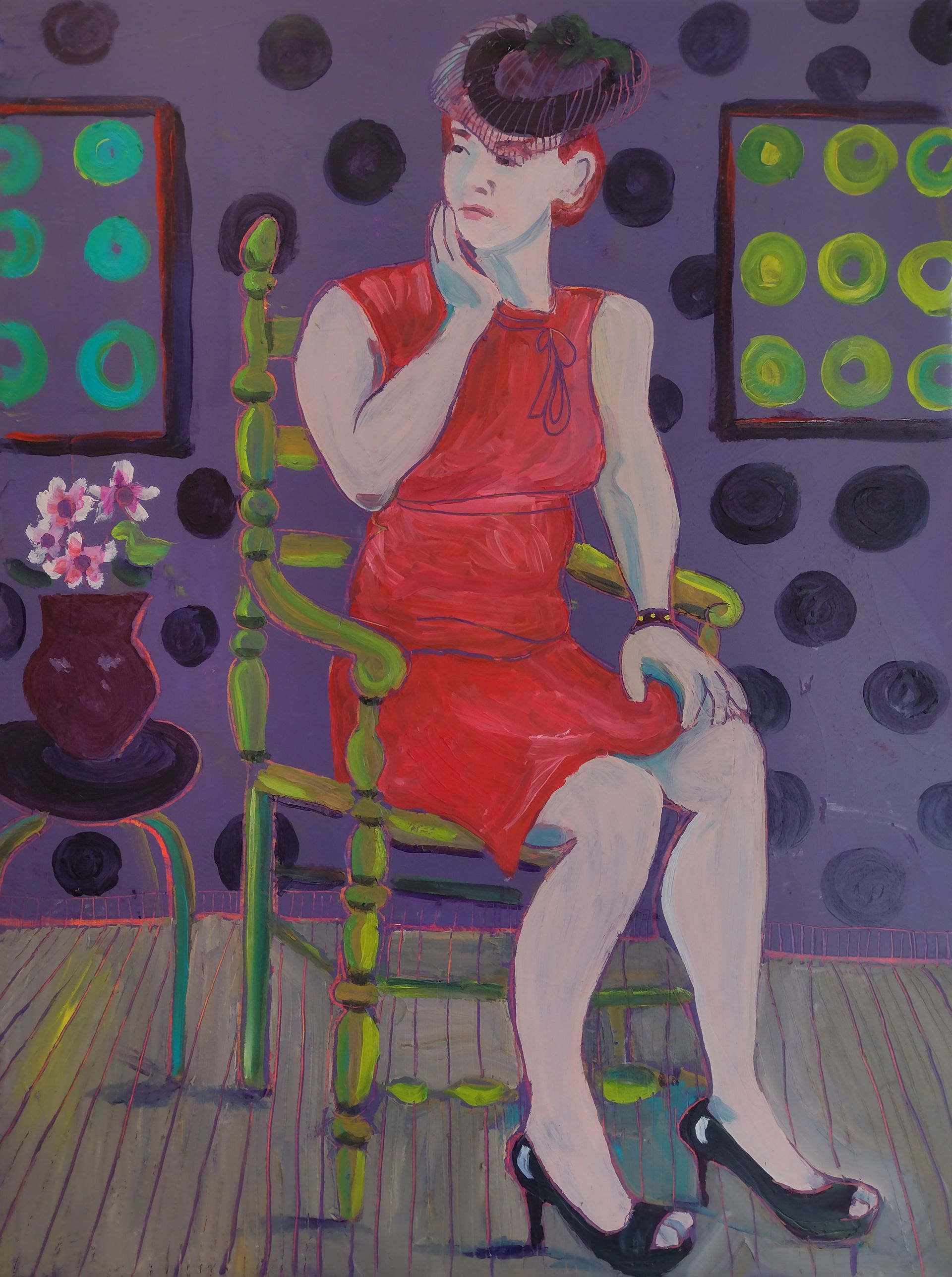 Woman in red dress seated on green chair, purple polka-dot background, two framed circles, small table with flowers.