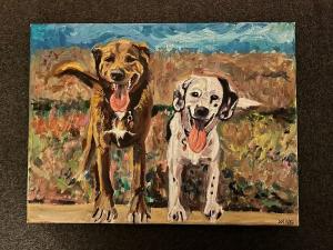 Two happy dogs, one brown, one Dalmatian, panting in front of a colorful, blurry landscape.