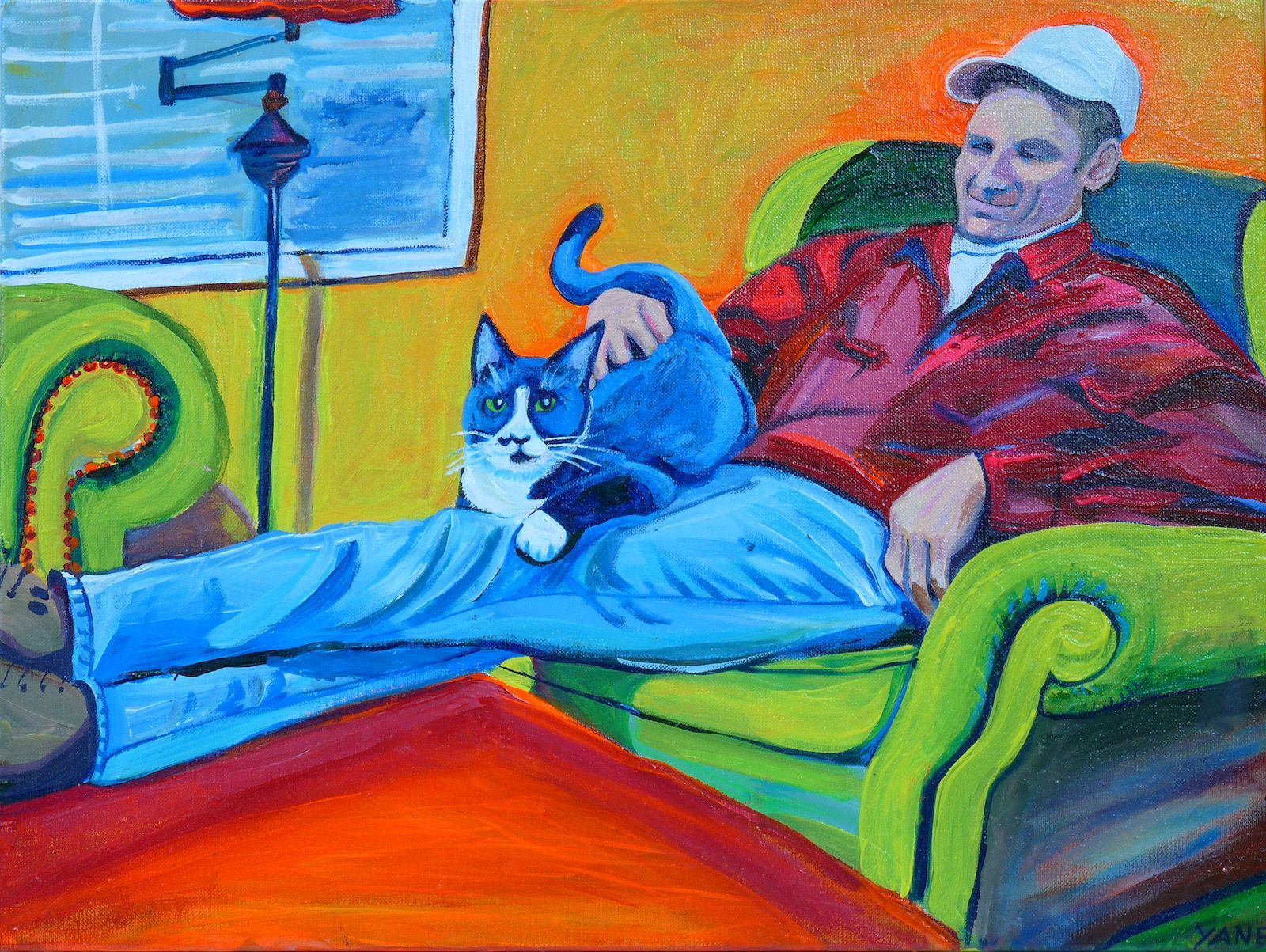 Man in red shirt relaxes with blue and white cat on his lap, seated in green chair.