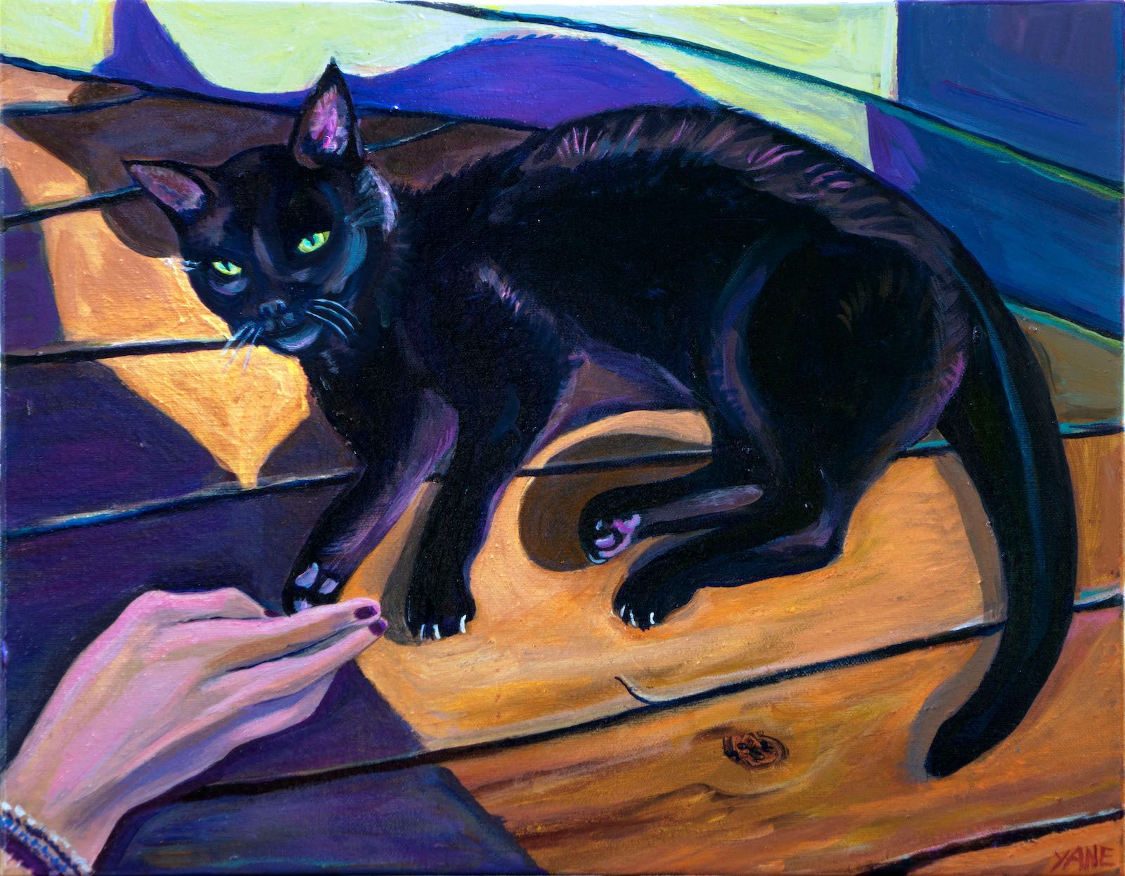 Black cat with glowing green eyes, arching its back, facing a reaching hand on wooden planks.