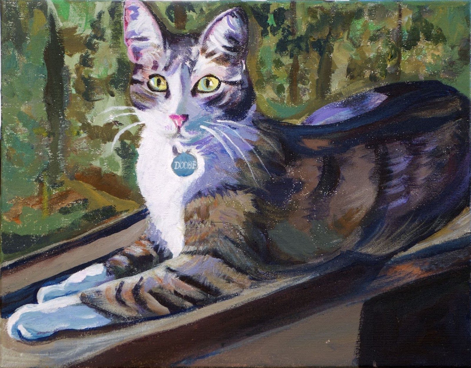 Tabby cat with white chest and paws, wearing a blue tag, resting on a wooden ledge with a blurred green background.