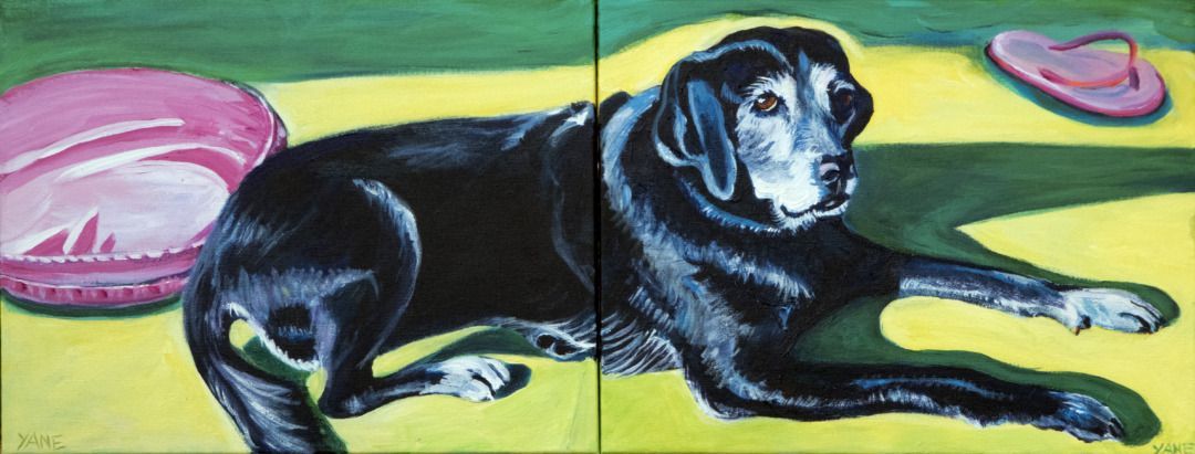 Painting of a black dog laying on a yellow surface next to a pink hat and pillow. Green background.
