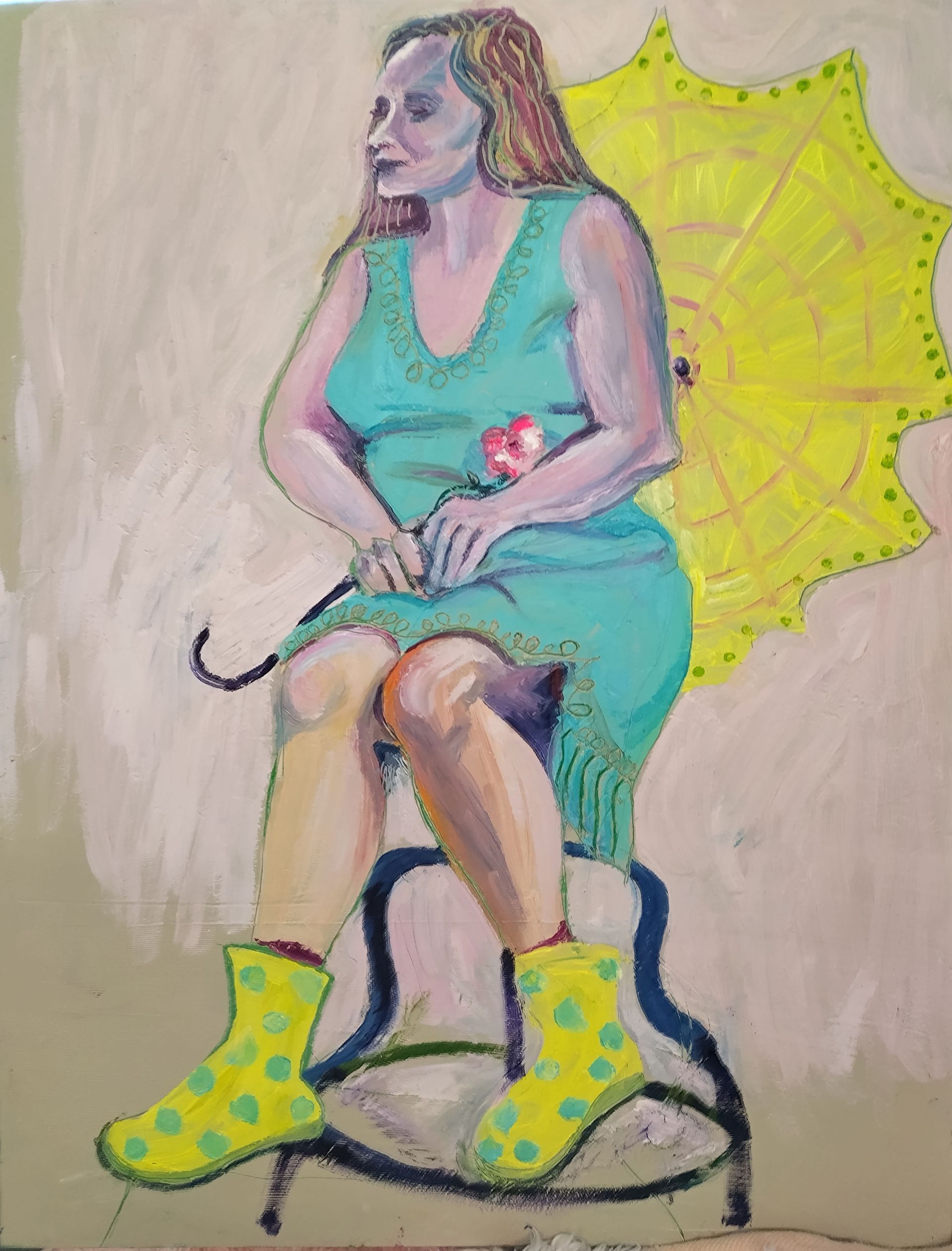 Woman in teal dress, yellow boots, and umbrella, holding a rose, seated.