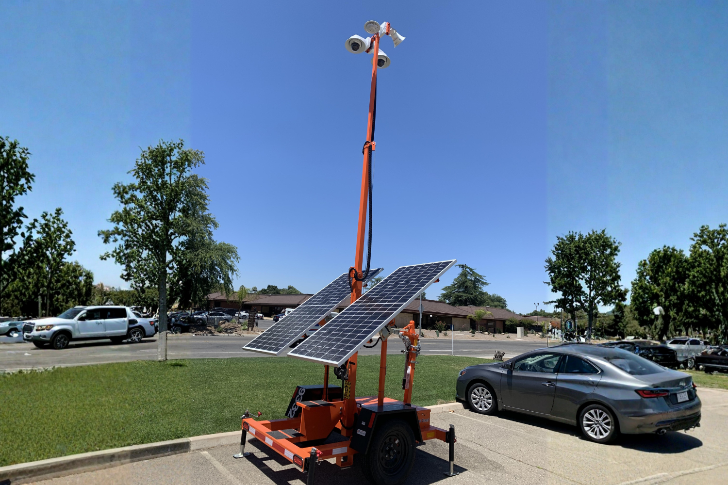 Telecommunication towers against a colorful sunset sky.