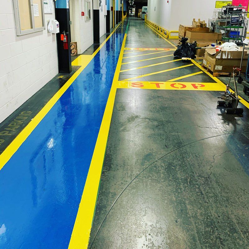 OSHA approved industrial zone markers using epoxy floor coatings.