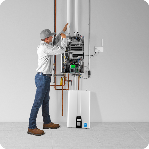 Man Repairing Electric Boiler — Massillon, OH — Kamph’s Hardware and Plumbing Services