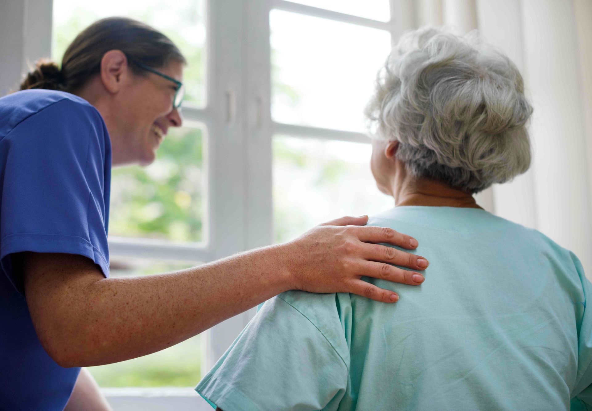 Texas Senior Care Transport_Nurse smiling to a patient