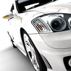 White sports car with chrome wheels, angled view, close-up of front.