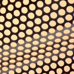 Perforated metal sheet with evenly spaced, circular holes.