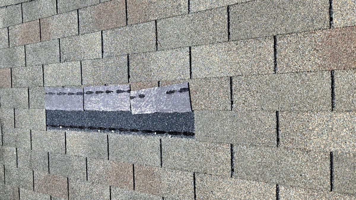 Shingle blown back from the wind on a Wilmington, NC roof.