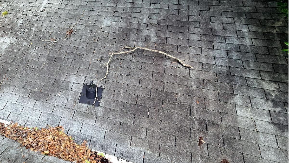 Debris on gathering on a roof and in the valleys on a home in Wilmington NC