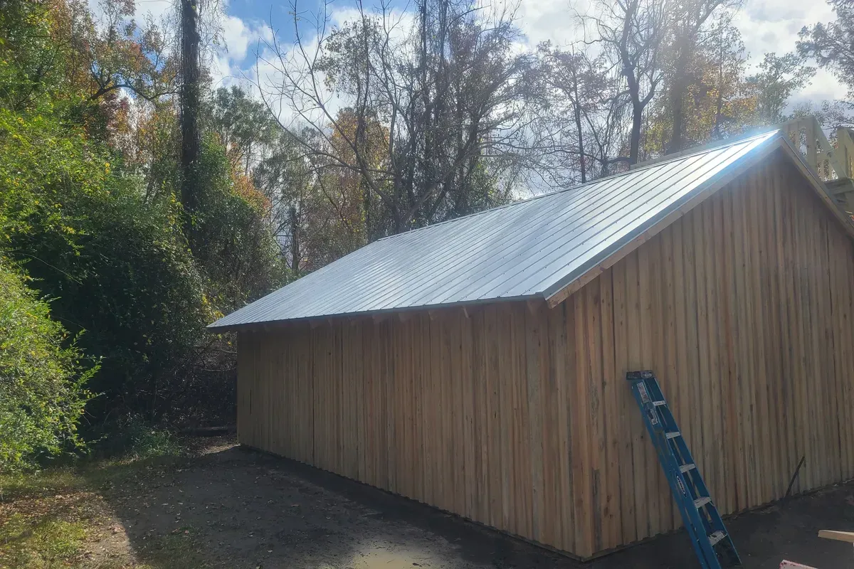  5V screw-down metal roofing system installed on a Castle Hayne NC structure, featuring clean panel alignment and durable galvanized finish.
