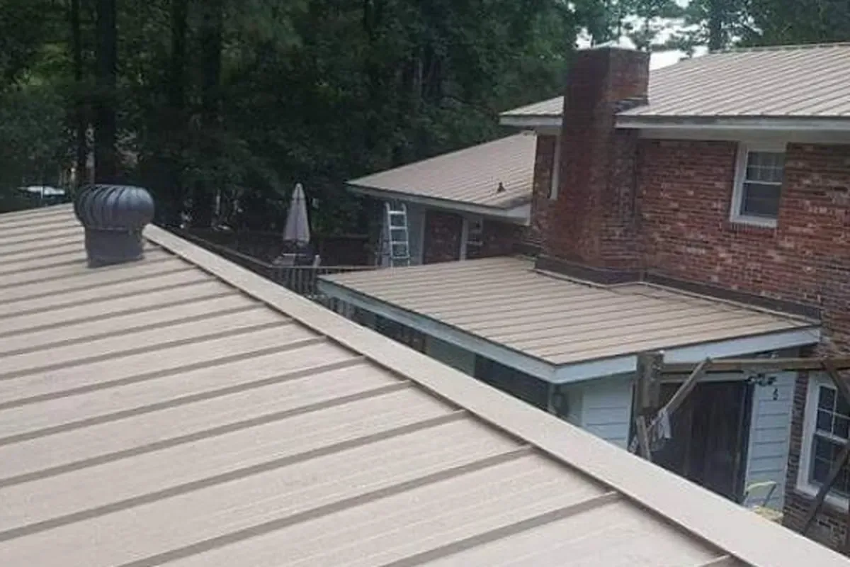  Snap-lock standing seam metal roof installation in Wilmington NC, showing precise panel fabrication and consistent rib spacing.
