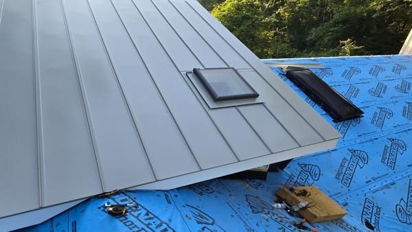 Sky light installation on a snap-lock standing seam metal roof in castle Hayne, NC