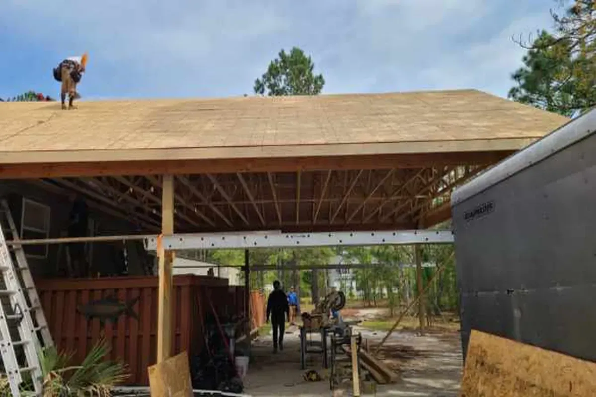 Carport framed onto existing home in costal Carolina