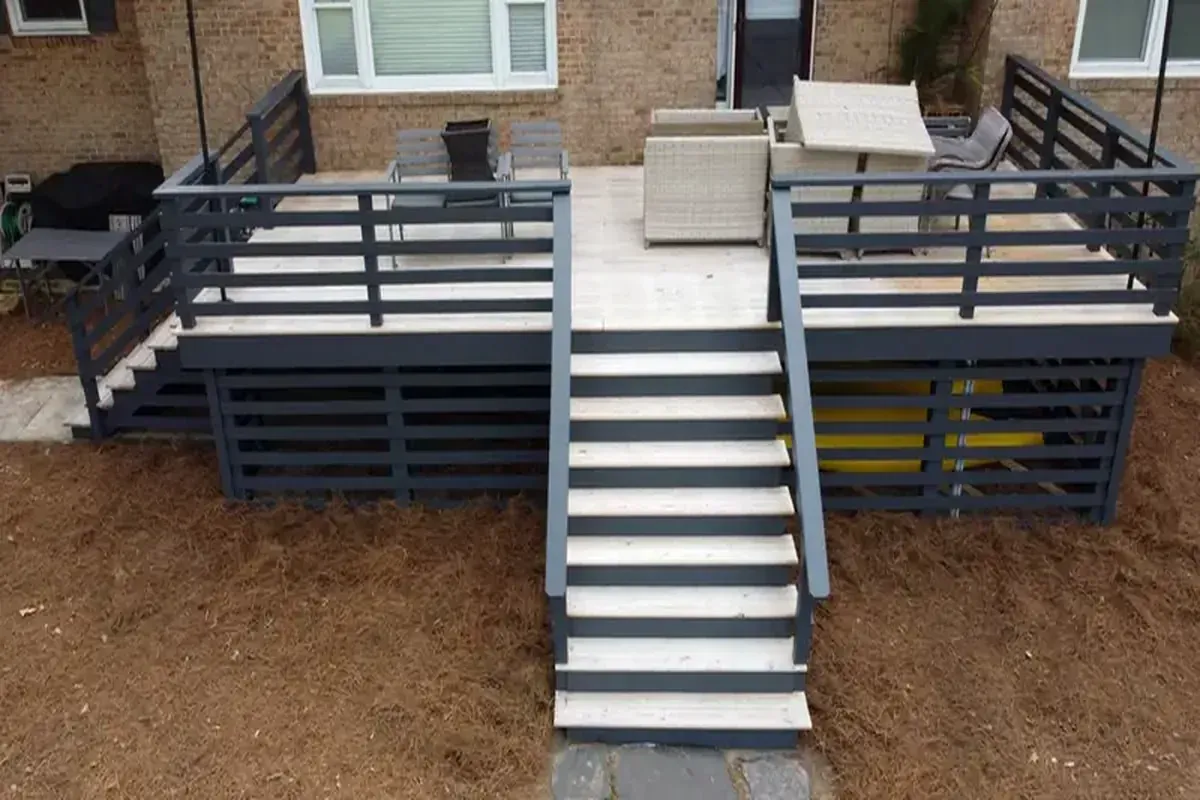 single level pressure treated deck attached to brick home