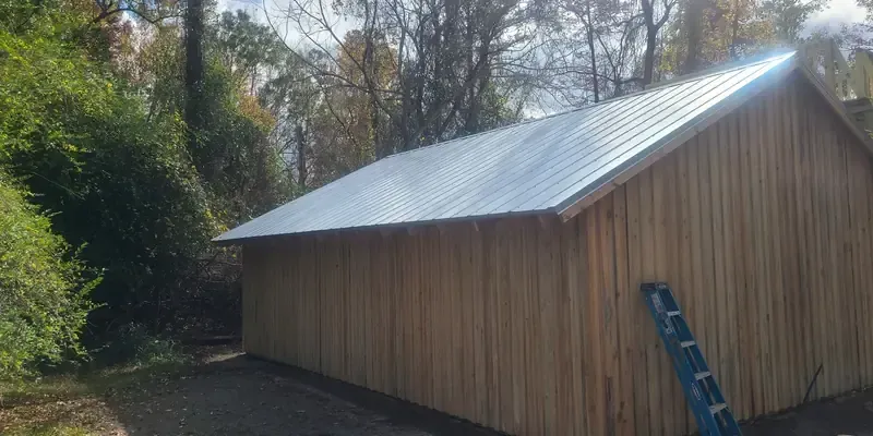 Custom board and batten barn with metal roof in Castle Hayne,  NC