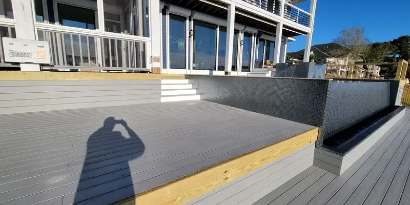 Multi level composite deck and stairs along pool