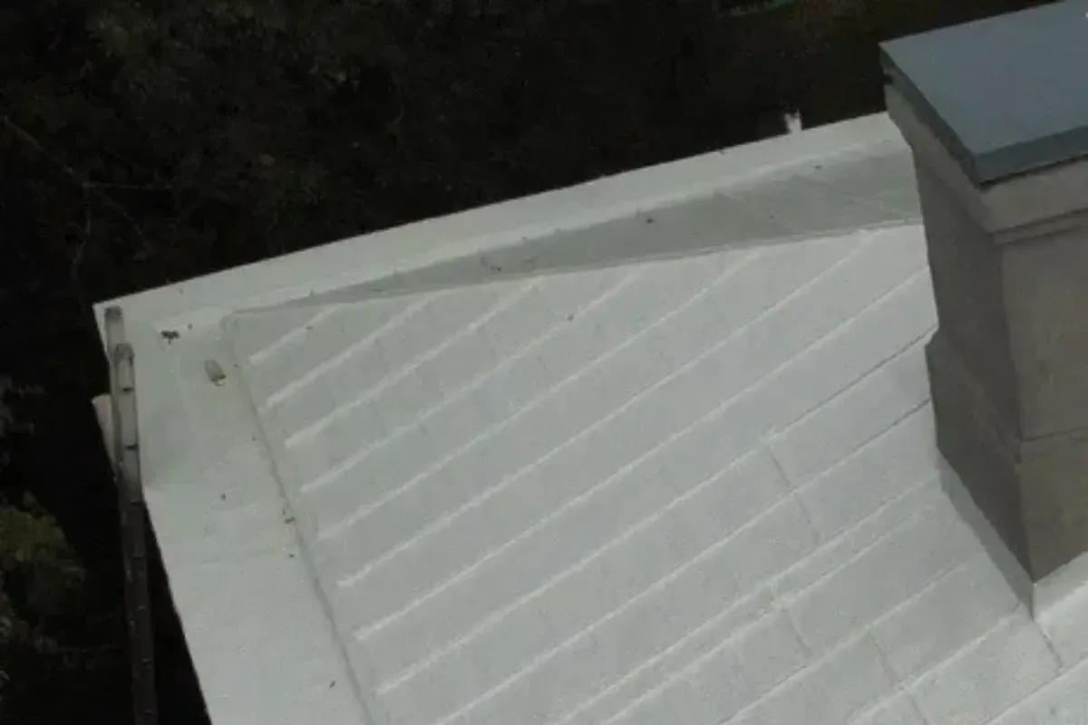 GAF roof coating applied to roof after built in gutter repairs were done in Wilmington, NC.