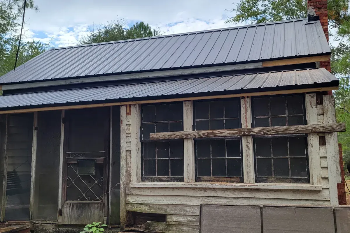 Beautiful Corrugated screw down metal roof installation on an old relic camp in Currie, NC
