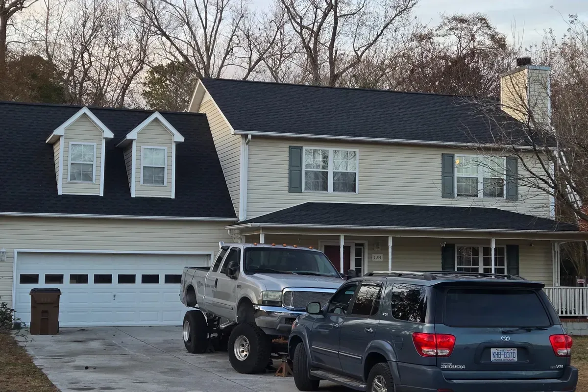 Roof flashing and chimney detail during roof replacement.