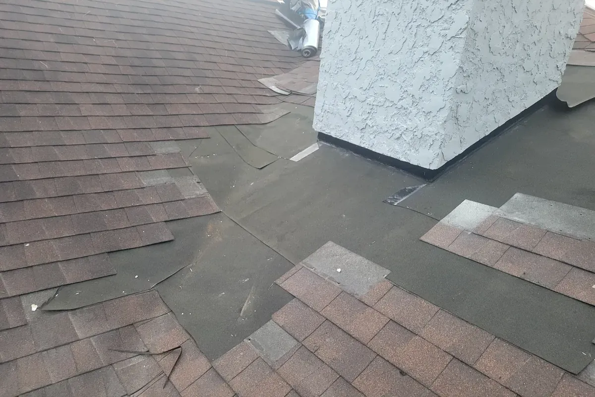 Chimney re-flashing job in progress wrapped in ice and water shield.