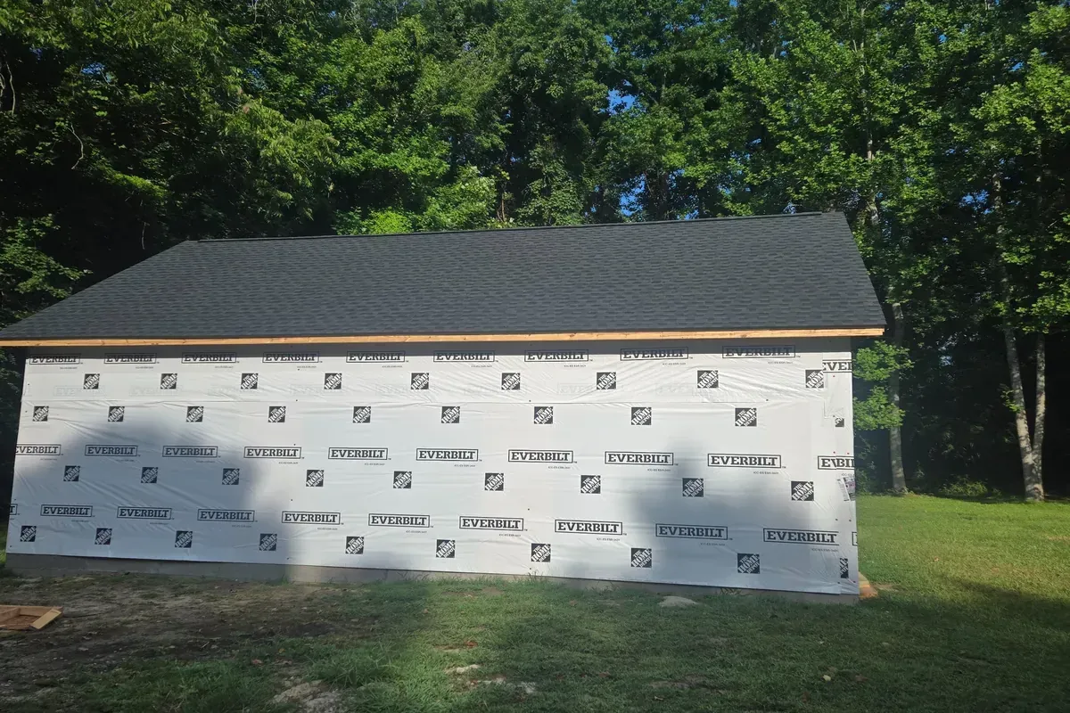 Dethatched garage roof installation with drip edge and ridge vent.