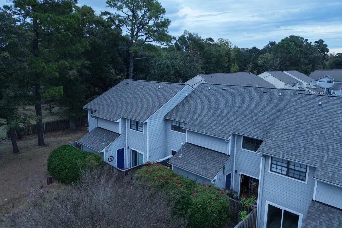 Shingle roof replacement Wilmington NC shown on a large multi-pitch home using CertainTeed Landmark architectural shingles for long-term storm protection.