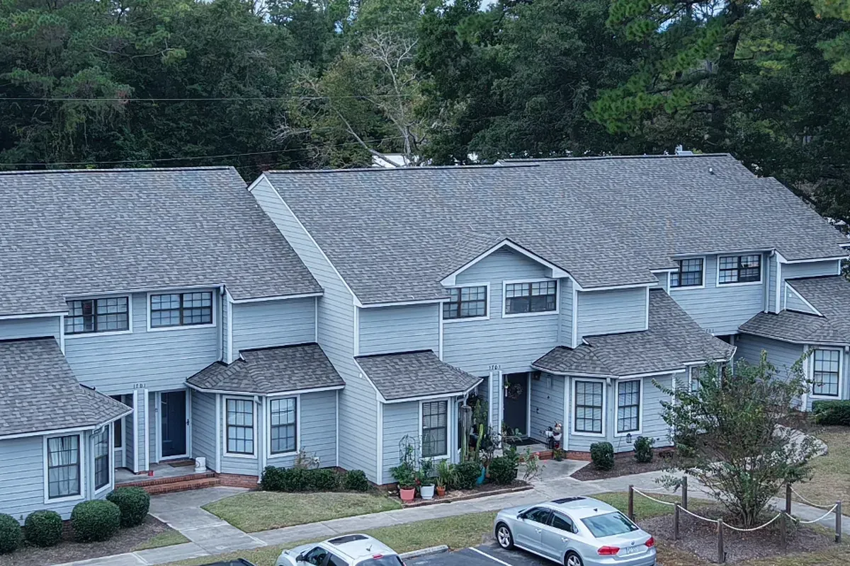 Wilmington shingle roofing company completing an architectural shingle roof replacement with upgraded ridge vent and drip edge protection.