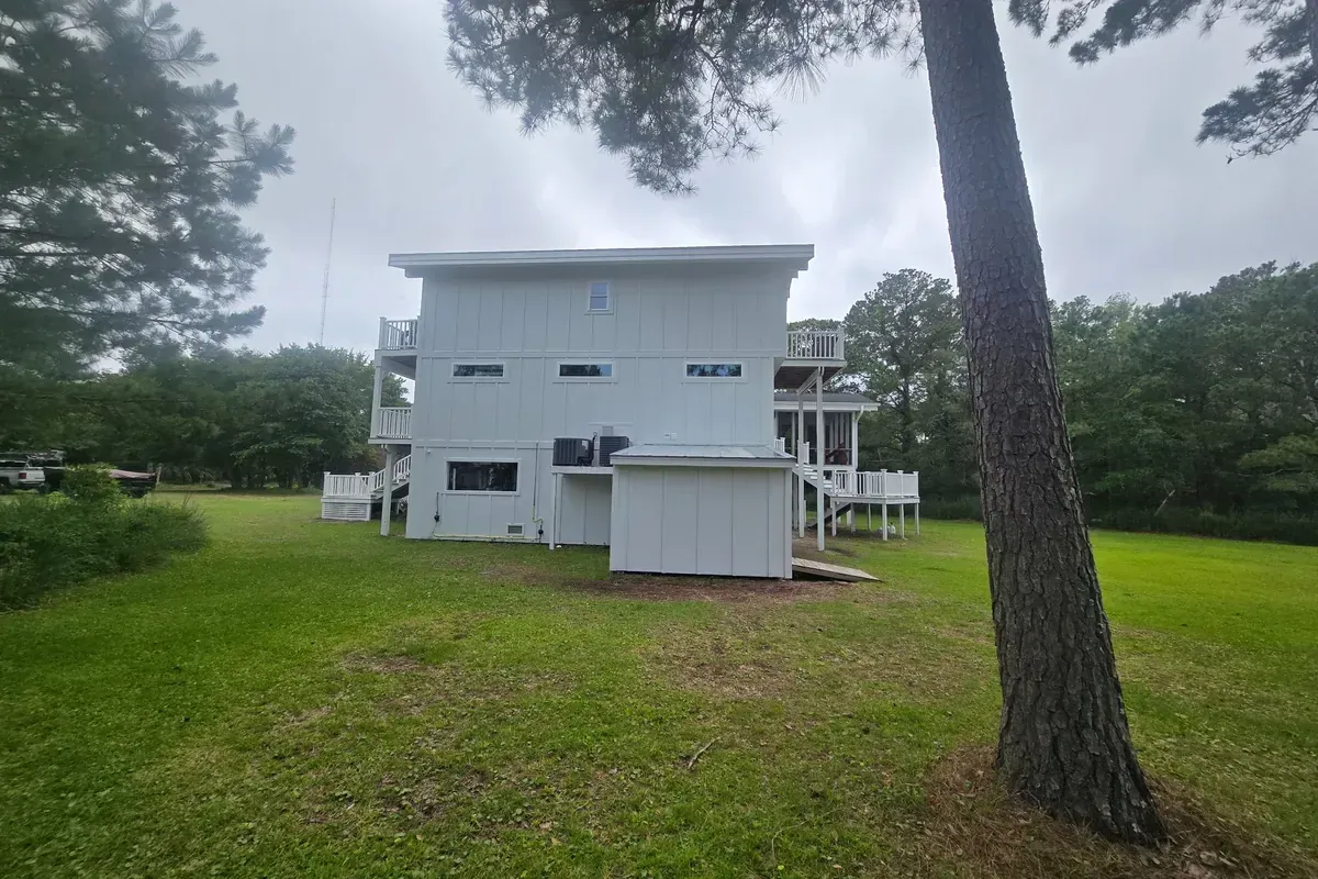 Exterior siding upgrade on elevated coastal home