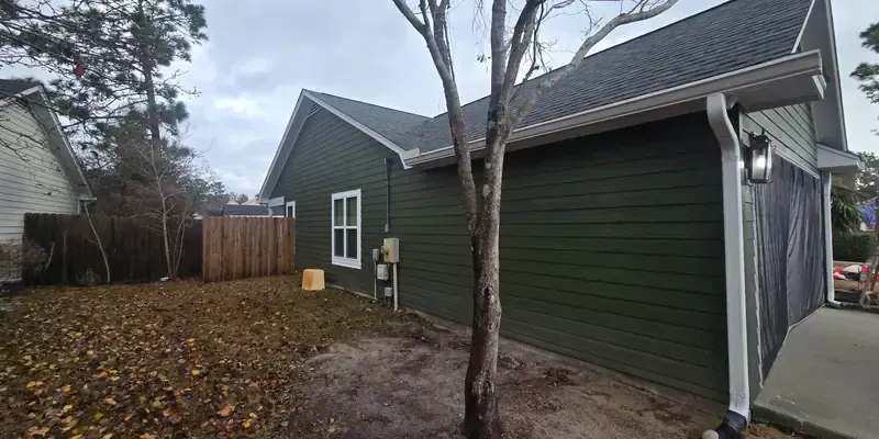 Residential siding replacement in Wilmington NC featuring Dutch lap vinyl siding and moisture-resistant barrier installation
