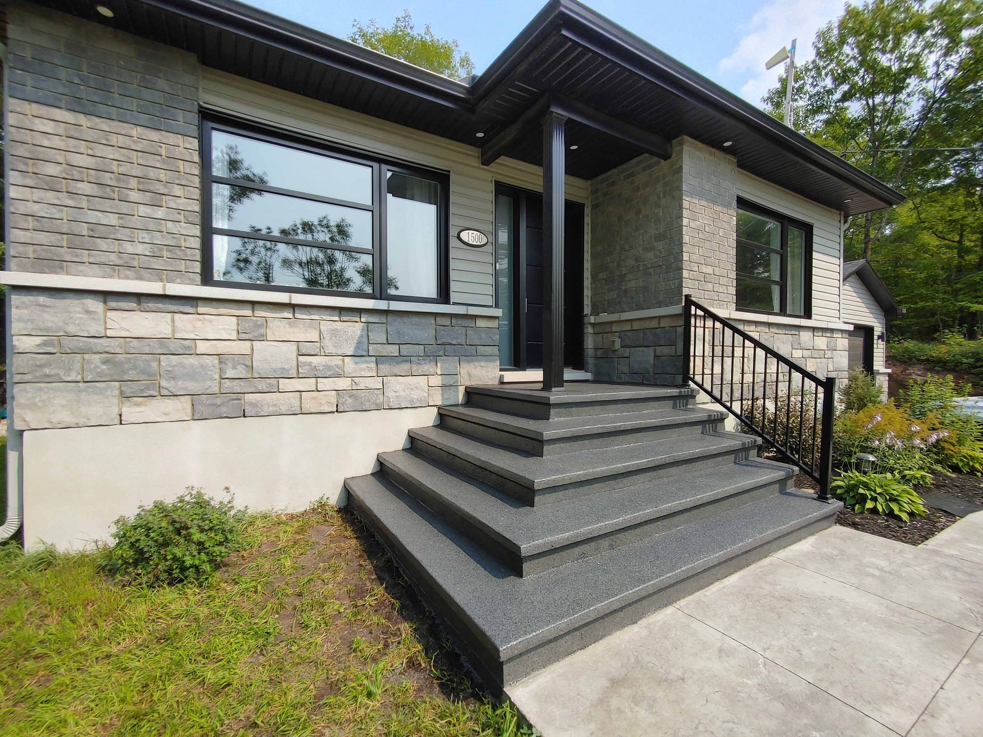 A house with stairs leading up to the front door