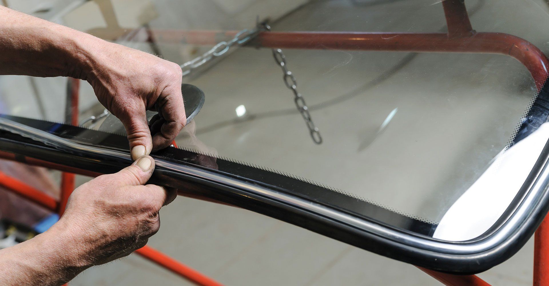 Car Mechanic Hands — Snellville, GA — Low Price Auto Glass