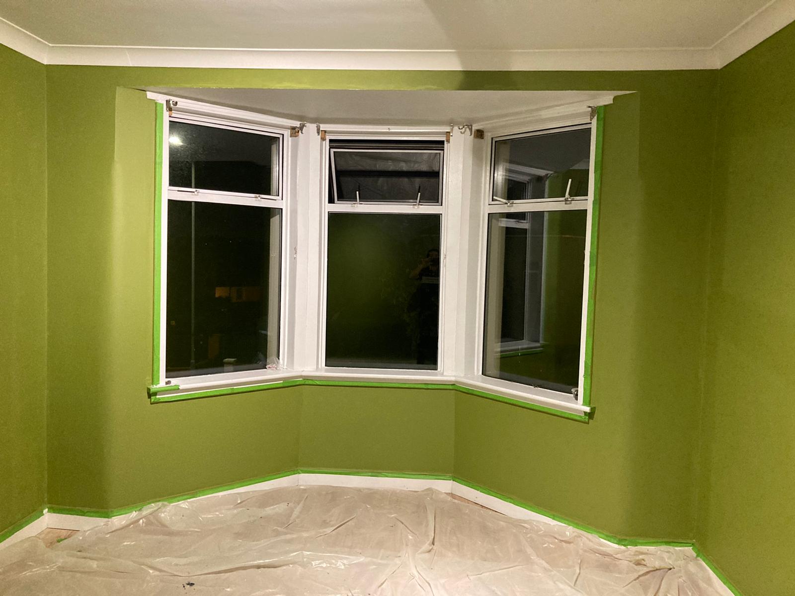 A picture of a living room painted in Green by painters and decorators Glasgow