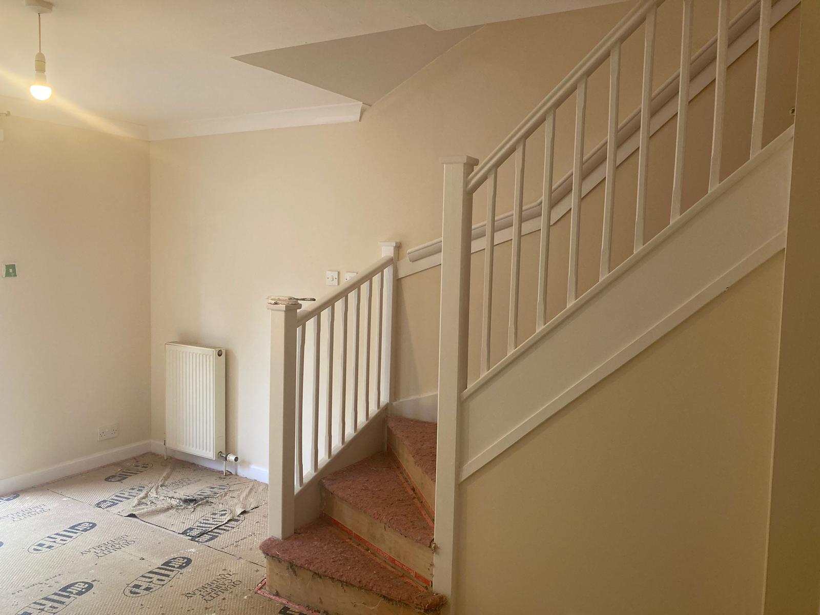 A picture of entrance stairs painted white by painters and decorators Glasgow